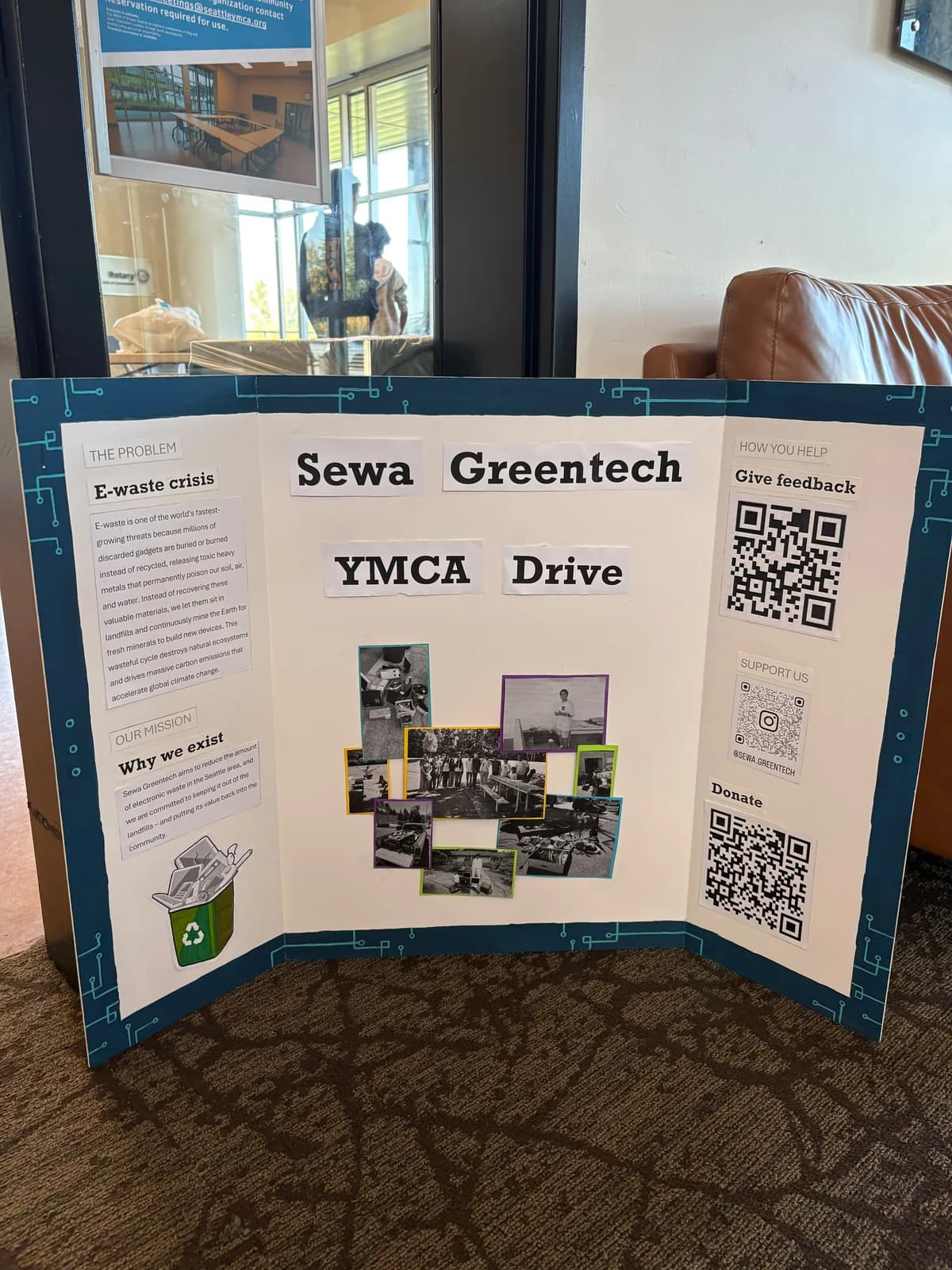 Sewa Greentech YMCA Drive display board beside a window